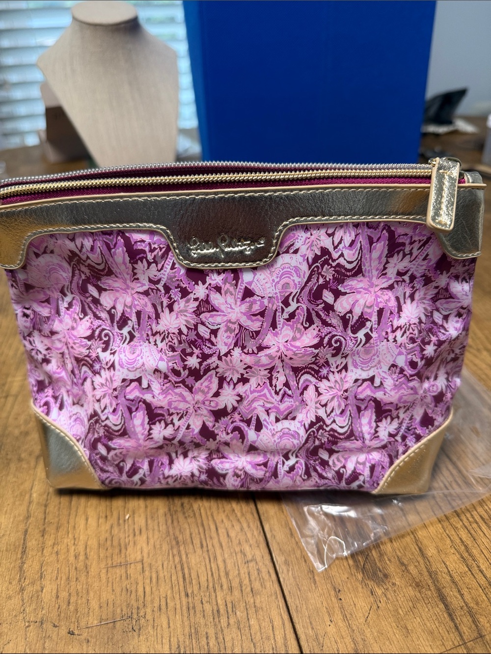 Lilly Pulitzer Floral Cosmetic Pouch with gold trim.